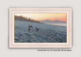 Framed picture of chasing brown hares