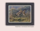 Framed canvas print of boxing hares